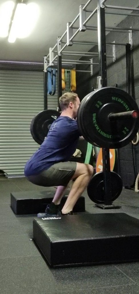 Front squat, performing a front squat and demonstrating correct technique as a personal trainer 